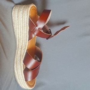 Cute rope platform sandals with a built in padded soles. Never worn.
